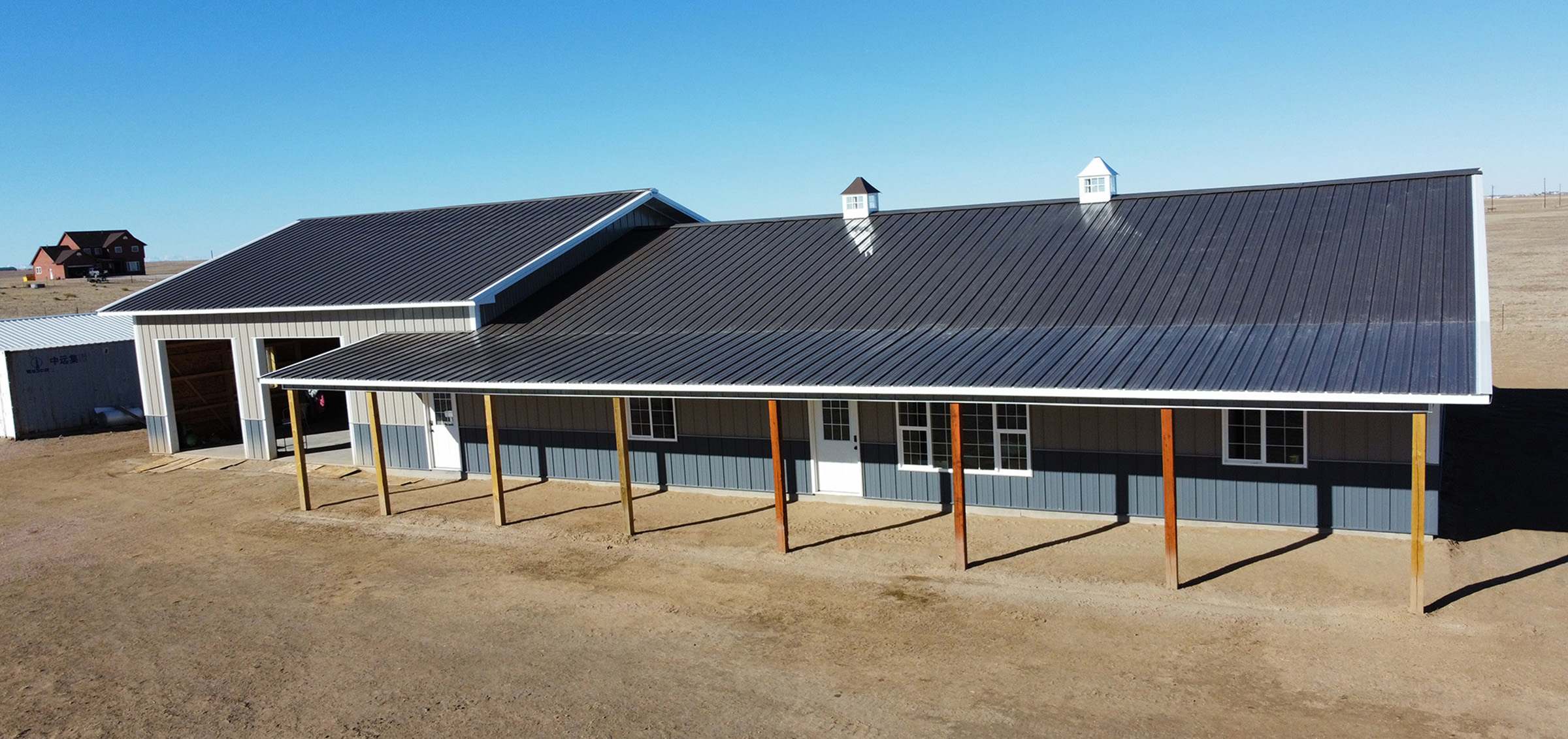 dark blue and gray pole barn barndominium