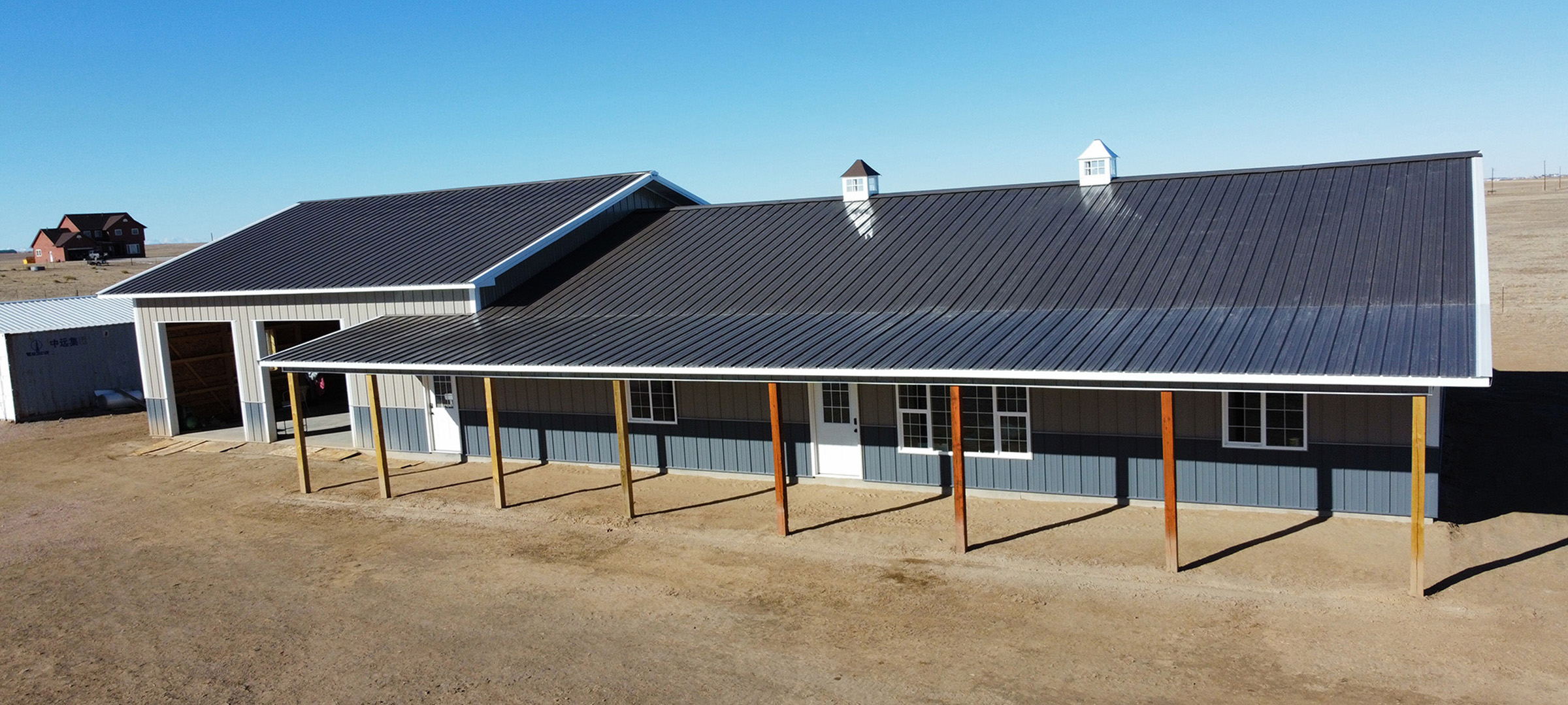 blue and gray post frame barndominium