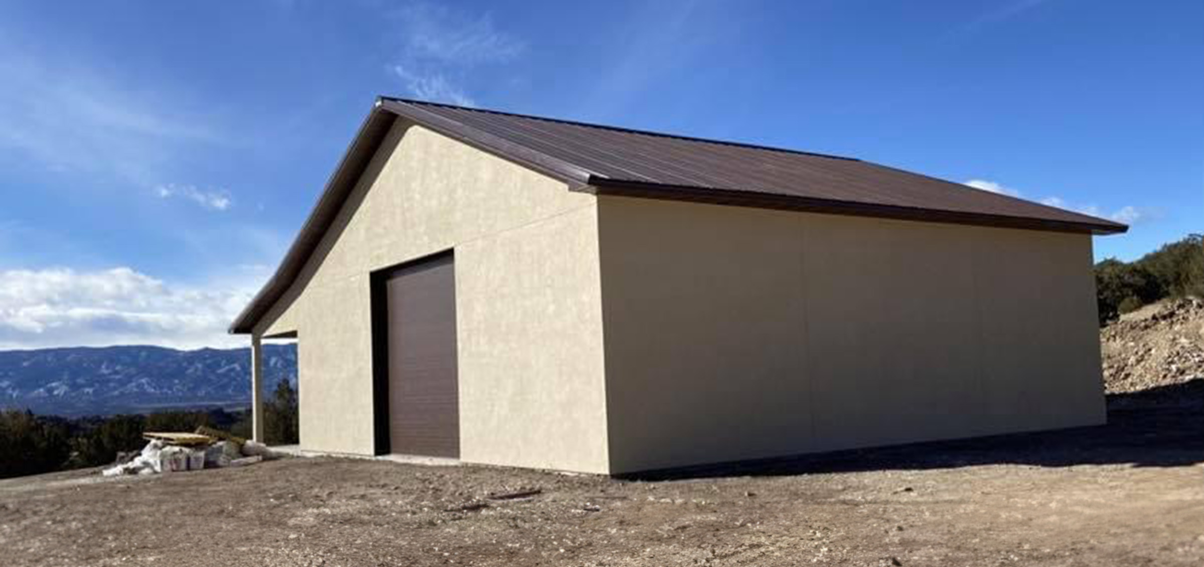 beige and brown post frame suburban bulding