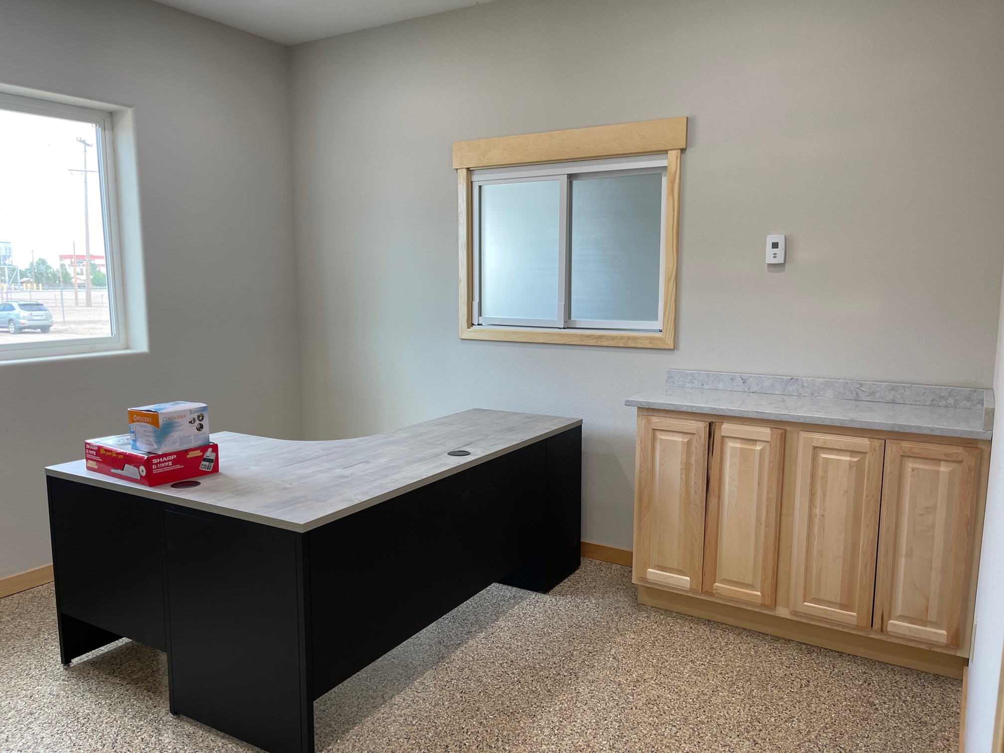 Office space showing a desk and four cabinets